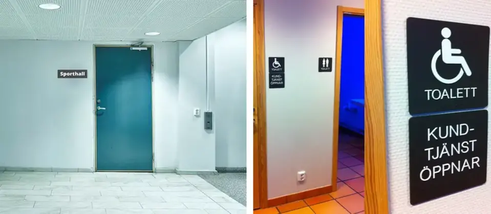 Mörkgrå skyltar med vit text sitter på sidan vid dörren. Exempel på två skyltar - toalett och sporthall.